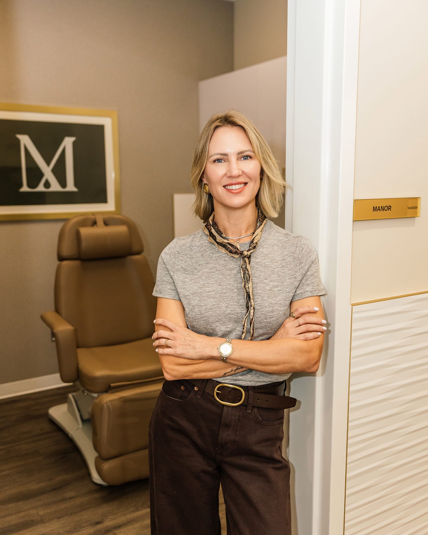 Lindsey Strelecki, BSN, RN, aesthetic nurse injector, at the door of her treatment room at Manor Aesthetics & Wellness in Fort Worth